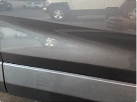 Before repair - door dent